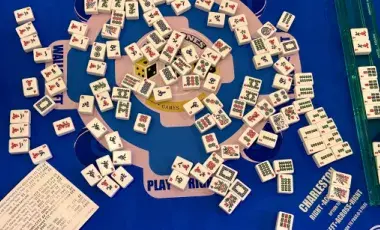 MahJong tiles being played mid-game.