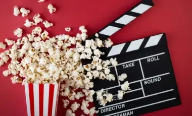 Spilled popcorn box and a clapperboard.