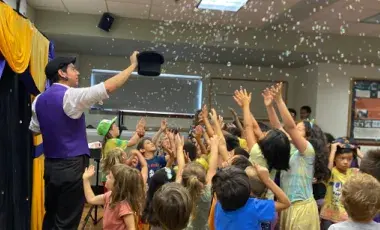 Arty Loon the magician putting on a show for children.