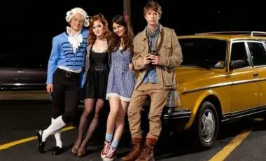 humans standing next to vehicle