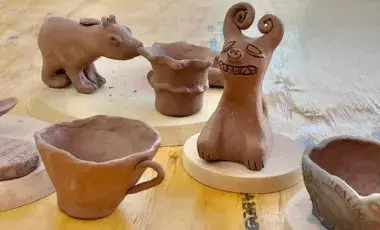 A handful of clay art pieces that are used for storytelling. 