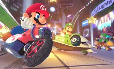 Video game character Mario on a red motorcycle. 