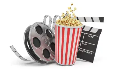 Reel of film, bucket of popcorn, and movie clapper