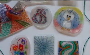 a number of shrinky dinks are laid out on a white surface