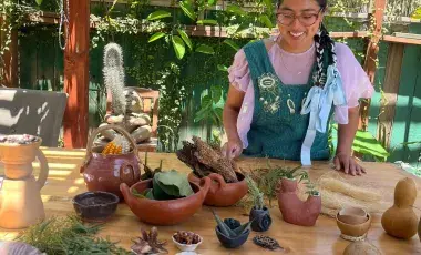 Assortment of clay items spread on a wooden table. 