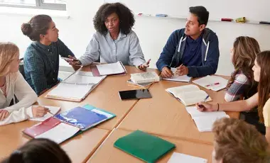 Group of teens sitting at a table
