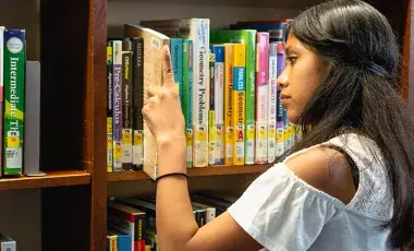 volunteer using the library