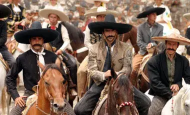 men with cowboy hats on horses