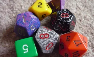 Group of orange, purple, red, green, and blue dice.