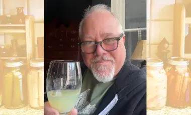 Ken Albala holding a wine glass