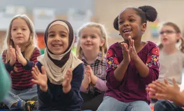 Kids clapping for storytime