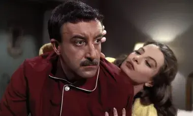 David Niven and Capuchine in character, pictured in pajamas 