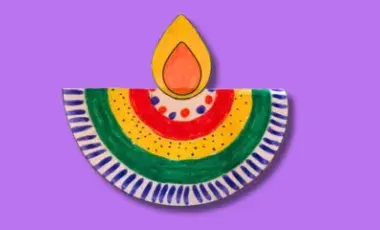 A colorful paper diya on a purple background.