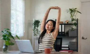 stretching at the desk
