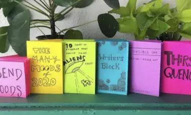 A display of zines on a table.