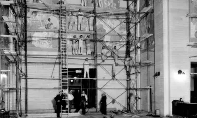 historic black and white photo of Dean Cornwell in rotunda