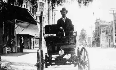 William K. Cowan sitting in a car, circa 1900.