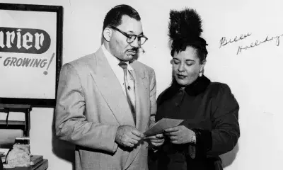 Walter Gordon, Jr. reviews a document with his client, Billie Holiday.
