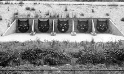 Cat faces painted on storm drain tension lids along the Burbank-Glendale section of the 5 freeway