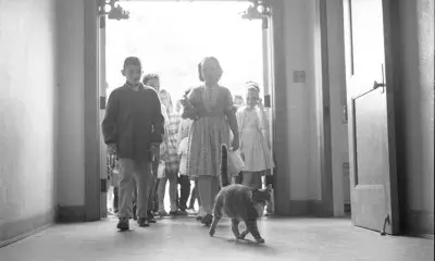 historic photo of children entering school