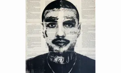 portrait of individual with facial tattoos