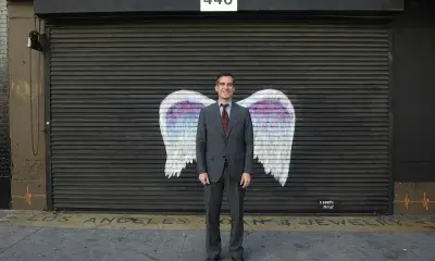 Portrait of Mayor Garcetti in front of wings