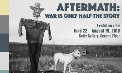 Exhibit postcard that reads "Aftermath: War is Only Half the Story"