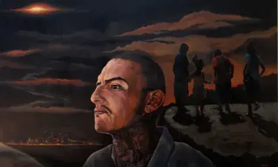 Portrait of person in front of landscape 