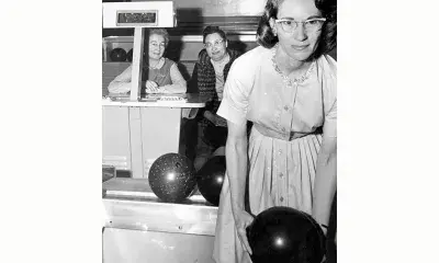 Person holding bowling ball, 1963.