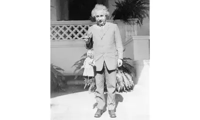 Albert Einstein poses with his portrait puppet, made by Harry Burnett, on the campus of Cal Tech in 1931.