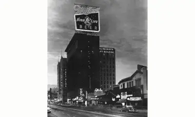 Vine Street building with neon signage on several buildings