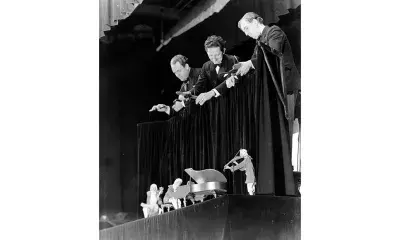 Forman Brown, Harry Burnett, and Richard Roddy Brandon perform with the Haydn Trio marionettes at the Barbizon Plaza in 1934.