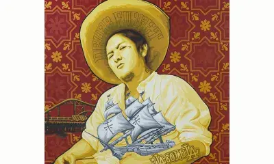 Mural of person holding model of ship with sails