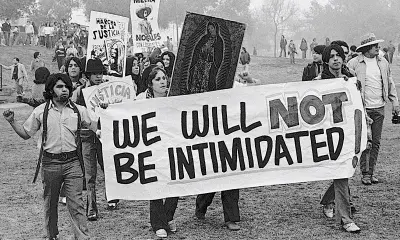 protestors carry sign that reads "we will not be intimidated"