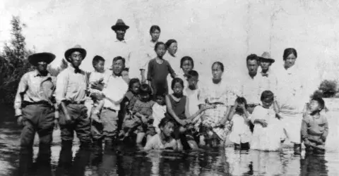 Korean American family at river, ca 1900