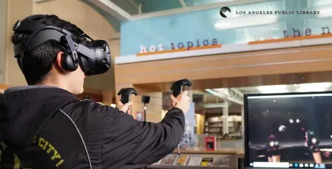 Teen using VR set at Central Library's Teen'Scape