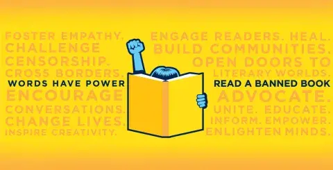 yellow banner with a blue fist in the air behind an open book