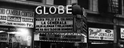 The marquee of the Globe Theater advertises Spanish-language entertainment in the early 1970s.