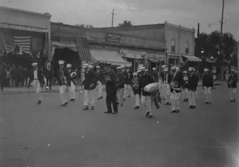 Marcelo Lopez and friends prepare to take part in a Fourth of July parade.