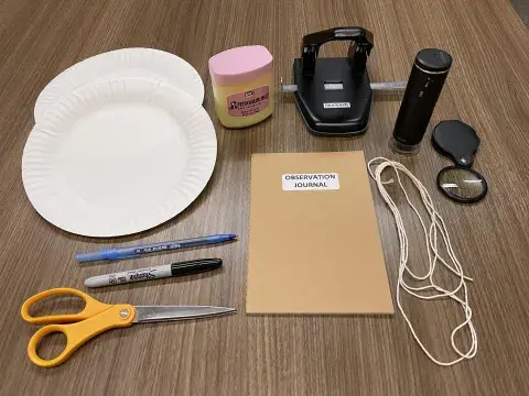materials needed for activity, including paper plate, string, and scissors