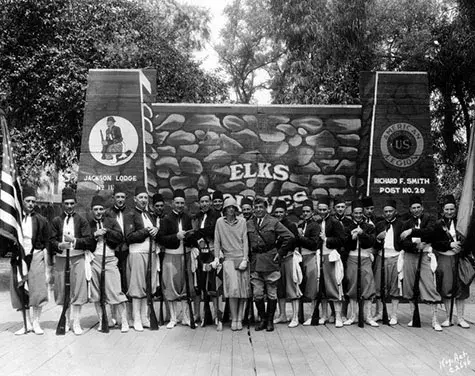 Amelia Earhart with a Drill Team during a Convention.