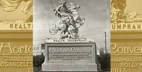 A roadside statue advertising Horton & Converse prescription pharmacists.