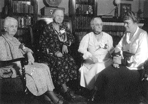Four city librarians sitting.