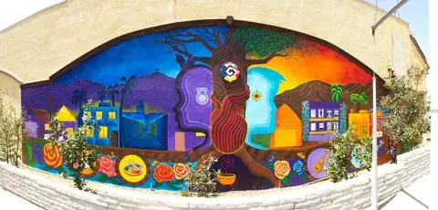 A mural depicting the tree of life, the masculine/feminine generating principles of the world, and the wholeness of self, community, earth, and spirit.