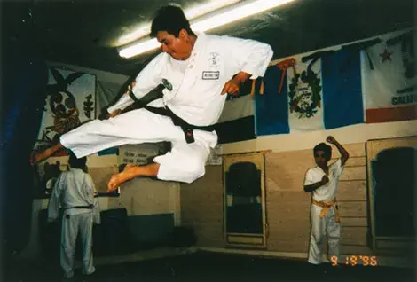 Karate expert Oscar Maldonado performs a flying side kick