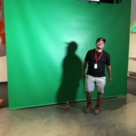 Man in front of the Lab green screen
