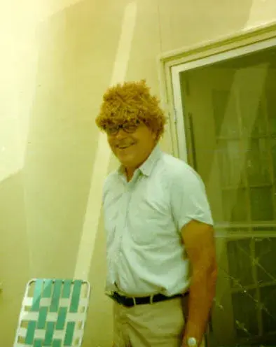 Forman Brown clowning it up in a wig at their home on Canyon Drive