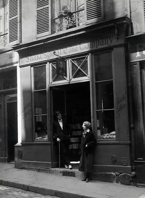 James Joyce and Sylvia Beach outside the door of Shakespeare and Company on the Rue de l