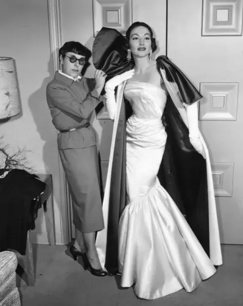 Head fits one of her creations on model Eileen Coughlin