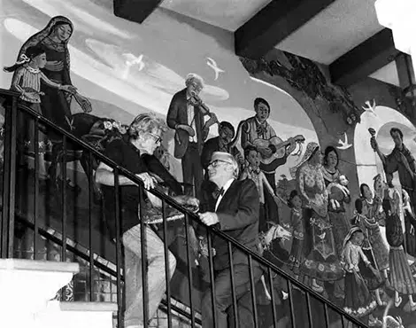 Leo Politi standing in front of Blessing of Animals mural on the Biscailuz Building